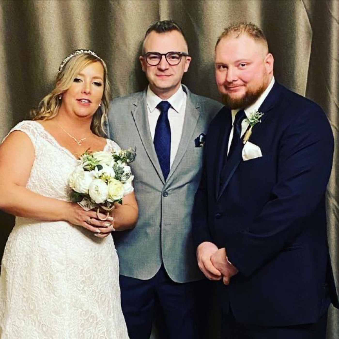 Tim McKeever with a bride and groom after officiating their wedding